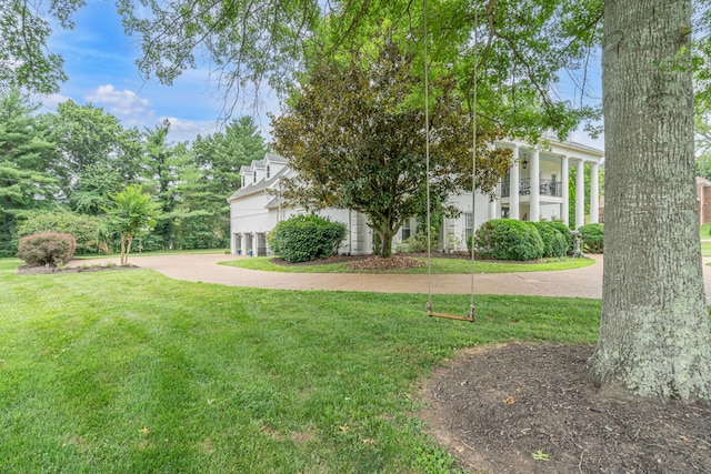 view of yard featuring a balcony