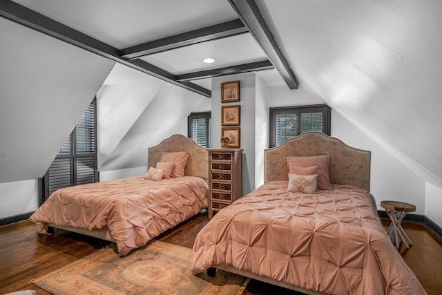 bedroom with wood-type flooring and vaulted ceiling with beams