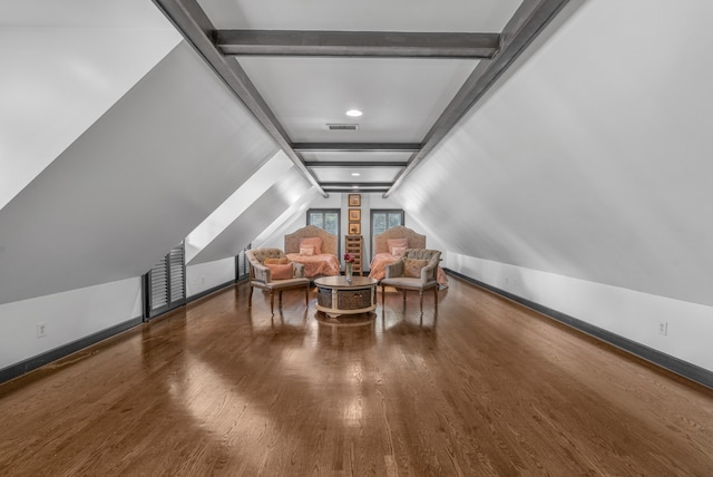 bonus room with lofted ceiling and hardwood / wood-style floors