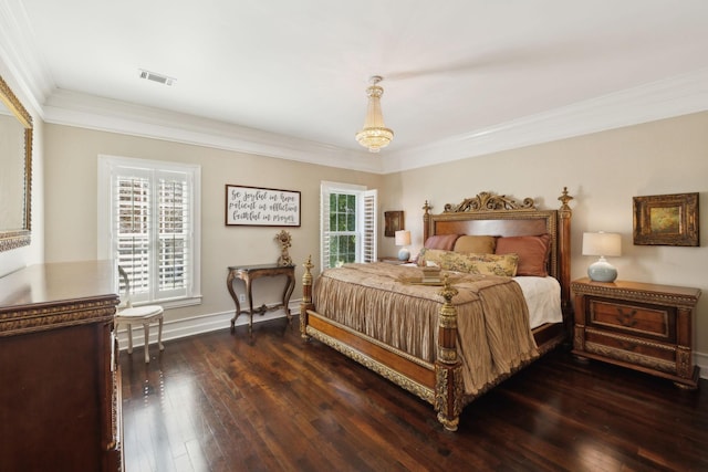 bedroom featuring visible vents, multiple windows, dark wood-type flooring, and ornamental molding