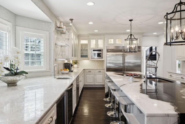 kitchen featuring a sink, a notable chandelier, and appliances with stainless steel finishes