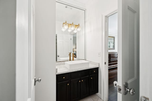 bathroom with visible vents and vanity