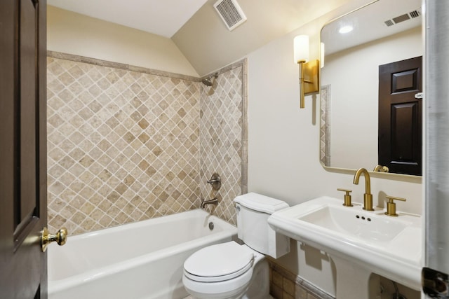 bathroom featuring visible vents, shower / washtub combination, toilet, and a sink