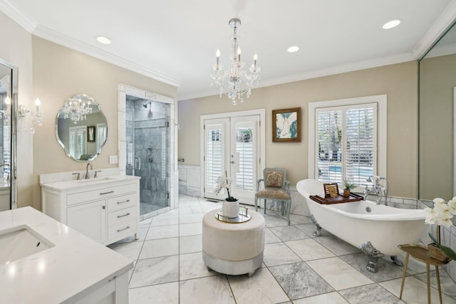 full bath featuring a sink, french doors, and crown molding