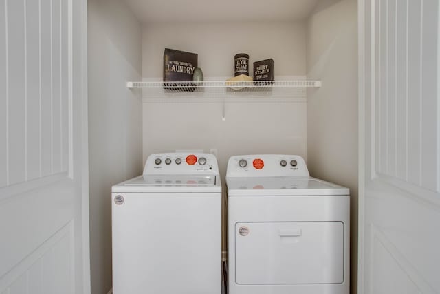 clothes washing area with independent washer and dryer