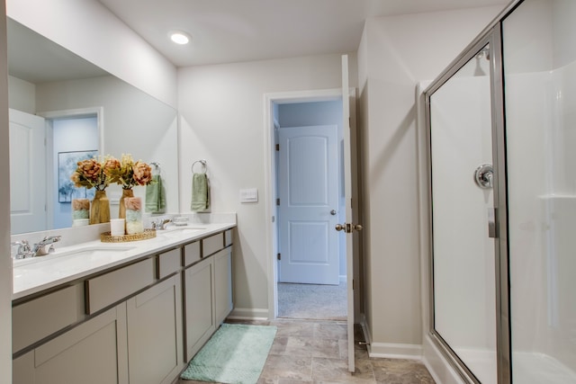 bathroom with vanity and an enclosed shower