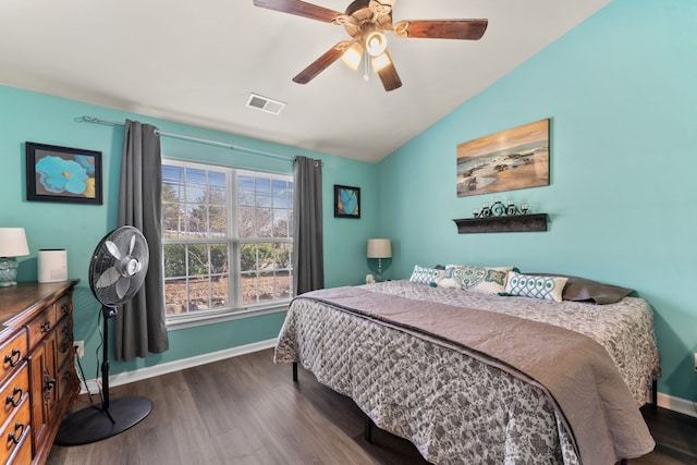 bedroom featuring dark hardwood / wood-style flooring, ceiling fan, and lofted ceiling