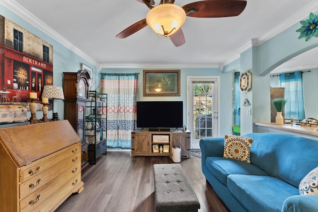 living room with ornamental molding and dark wood-type flooring