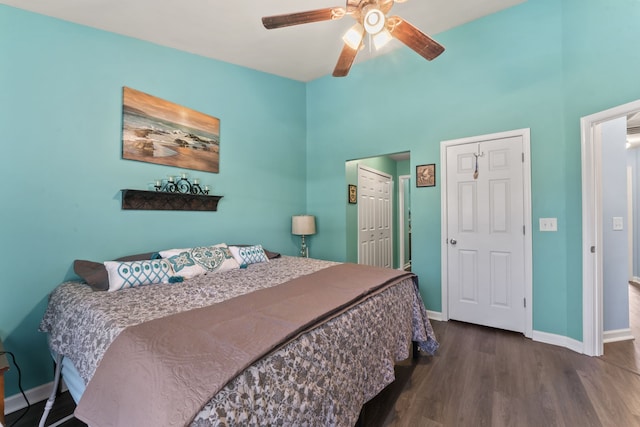 bedroom with ceiling fan and dark hardwood / wood-style flooring