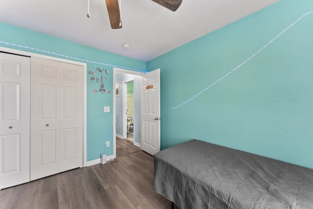 bedroom featuring hardwood / wood-style floors, ceiling fan, and a closet