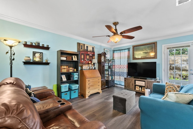 living room featuring dark hardwood / wood-style floors, ceiling fan, and ornamental molding