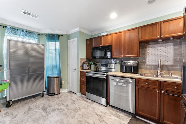 kitchen featuring decorative backsplash, sink, ornamental molding, and stainless steel appliances