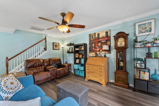 living room with ceiling fan, dark hardwood / wood-style flooring, and ornamental molding