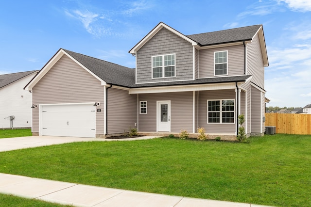 view of front of home with covered porch, a garage, central AC, and a front yard