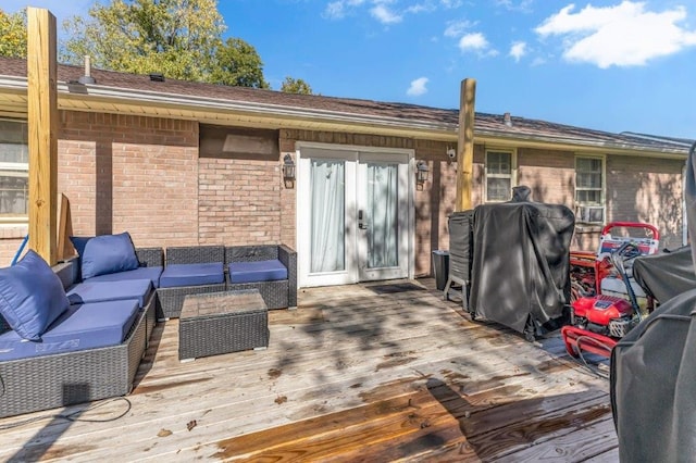 deck featuring an outdoor living space and grilling area