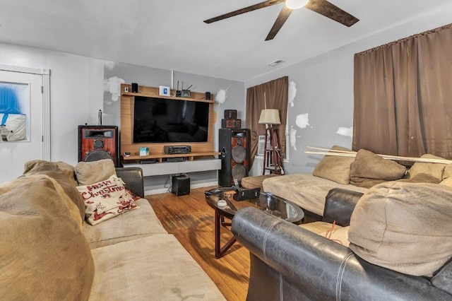 living room with ceiling fan and light hardwood / wood-style floors