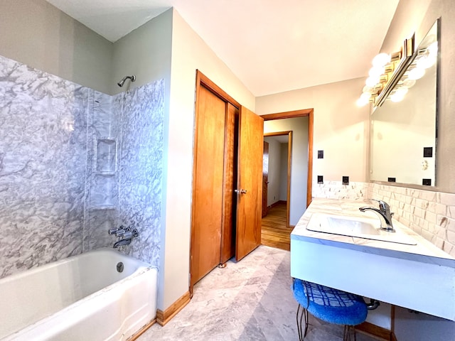 bathroom featuring bathing tub / shower combination and vanity