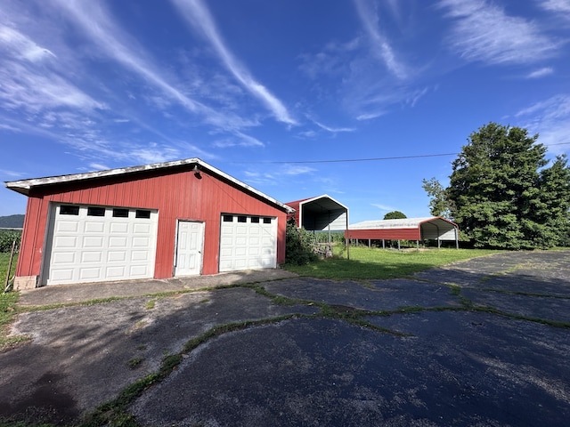 garage featuring a carport