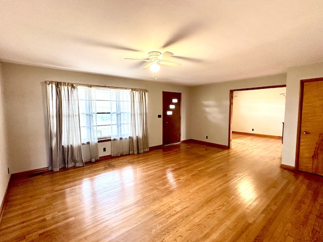 interior space featuring hardwood / wood-style floors and ceiling fan