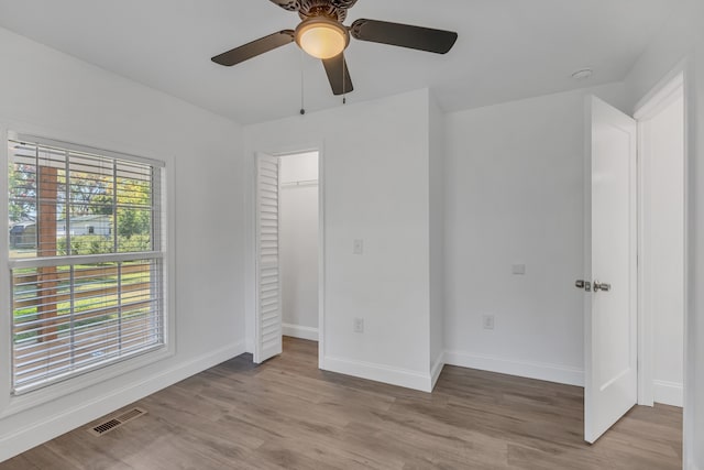 unfurnished room featuring ceiling fan and light hardwood / wood-style floors