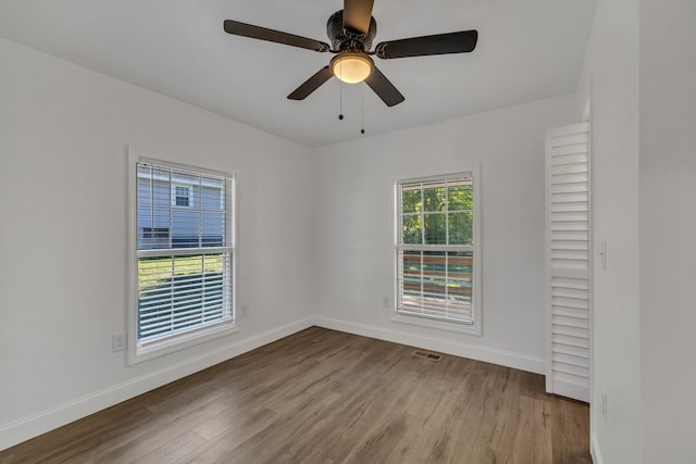 unfurnished room featuring light hardwood / wood-style flooring and ceiling fan