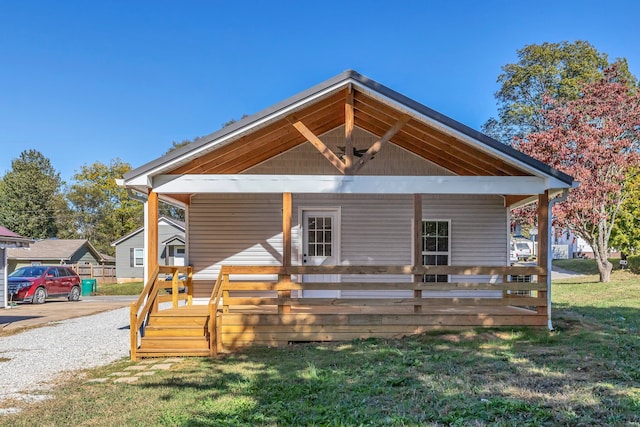 view of front of home featuring a front yard and a porch