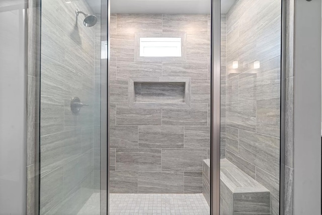 bathroom with a shower with shower door