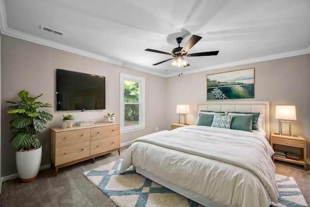 bedroom featuring ceiling fan, crown molding, and dark colored carpet