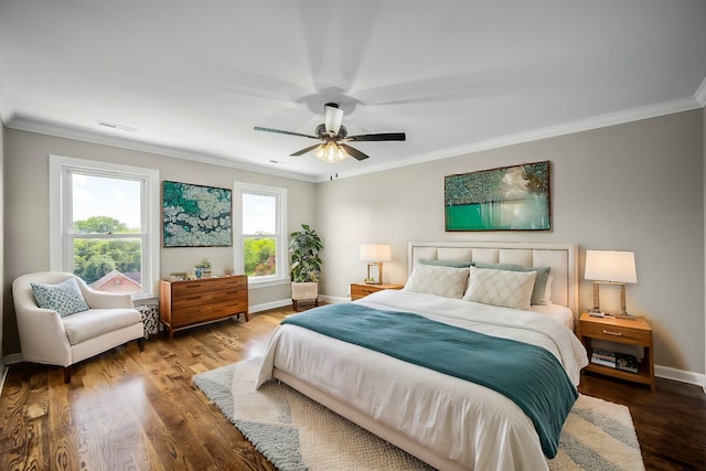 bedroom with ceiling fan, crown molding, and hardwood / wood-style flooring