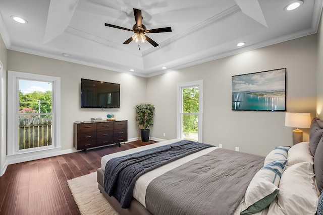 bedroom featuring a tray ceiling, ceiling fan, and crown molding