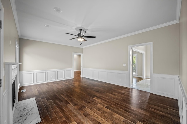 unfurnished living room with dark hardwood / wood-style flooring, crown molding, a fireplace, and ceiling fan