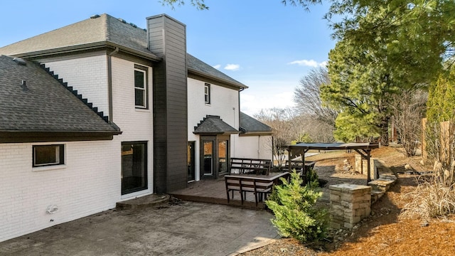 back of house with a patio