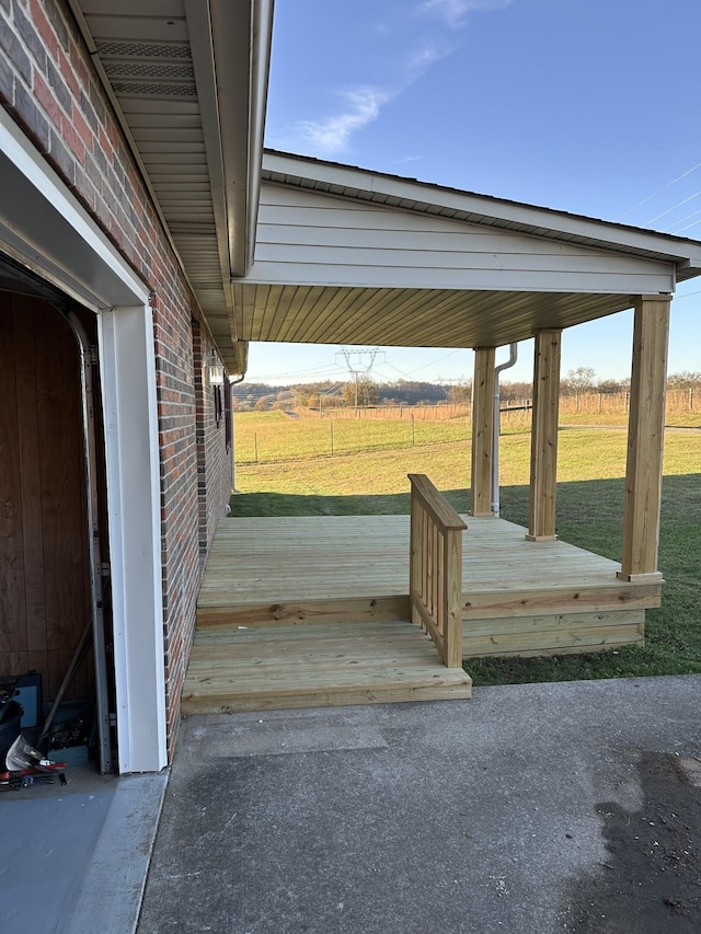 exterior space with a lawn and a rural view