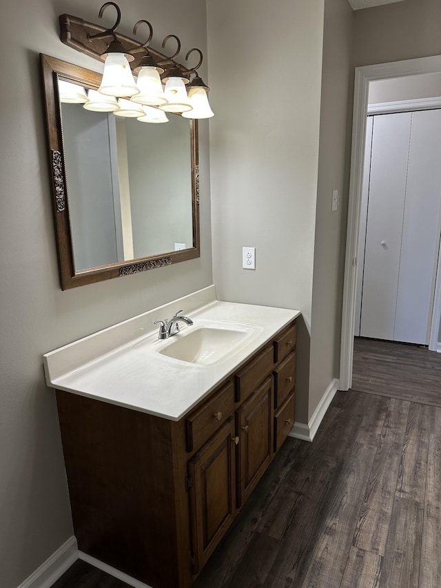 bathroom featuring wood-type flooring and vanity