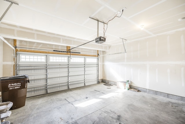 garage featuring a garage door opener