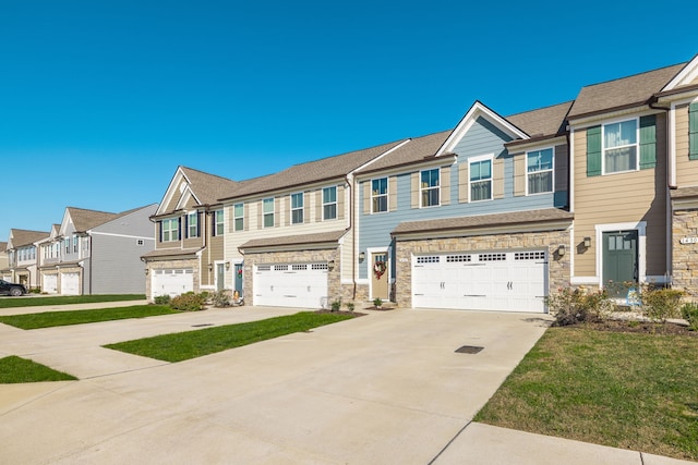 townhome / multi-family property featuring a garage