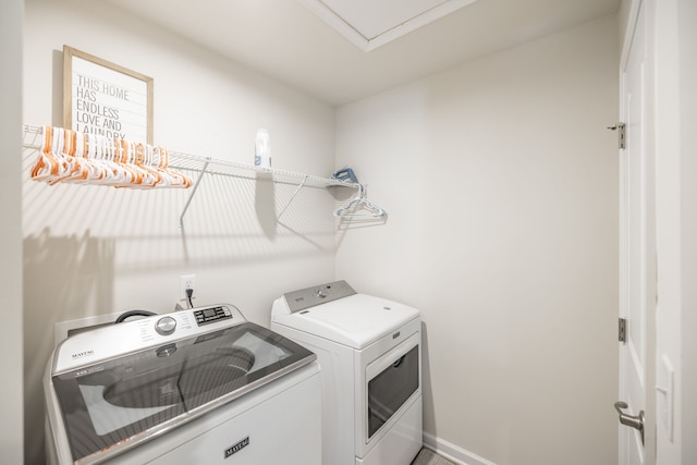 clothes washing area featuring washing machine and dryer