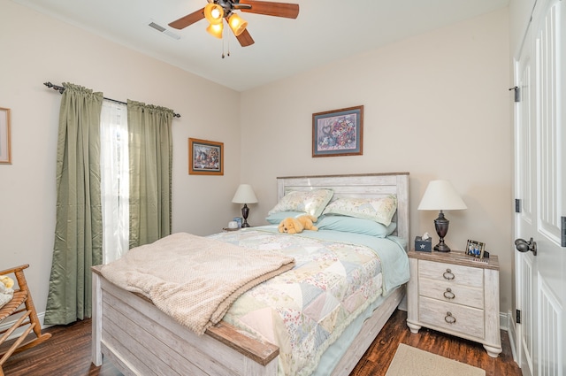 bedroom featuring ceiling fan and dark hardwood / wood-style floors