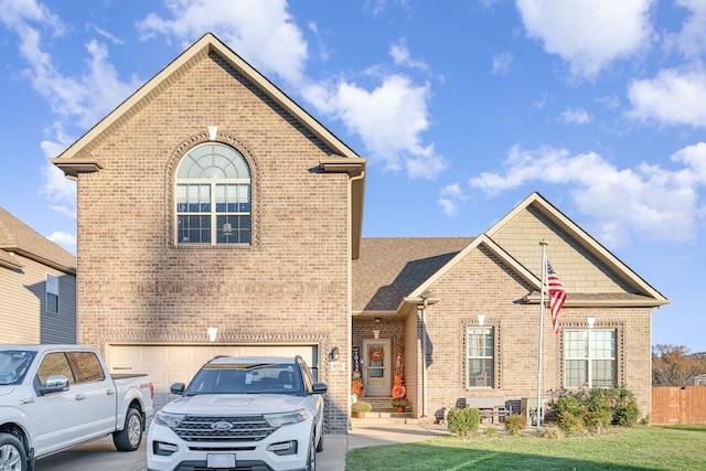 front of property featuring a garage and a front yard