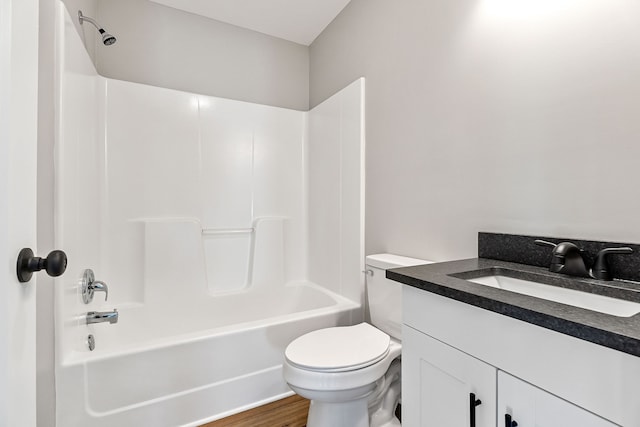 full bathroom featuring vanity, shower / bath combination, hardwood / wood-style flooring, and toilet