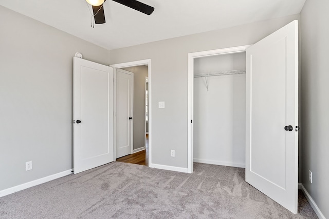 unfurnished bedroom with carpet floors, a closet, and ceiling fan