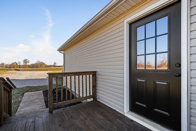 view of exterior entry featuring a deck