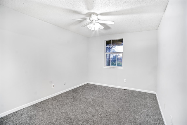 carpeted empty room with a textured ceiling and ceiling fan