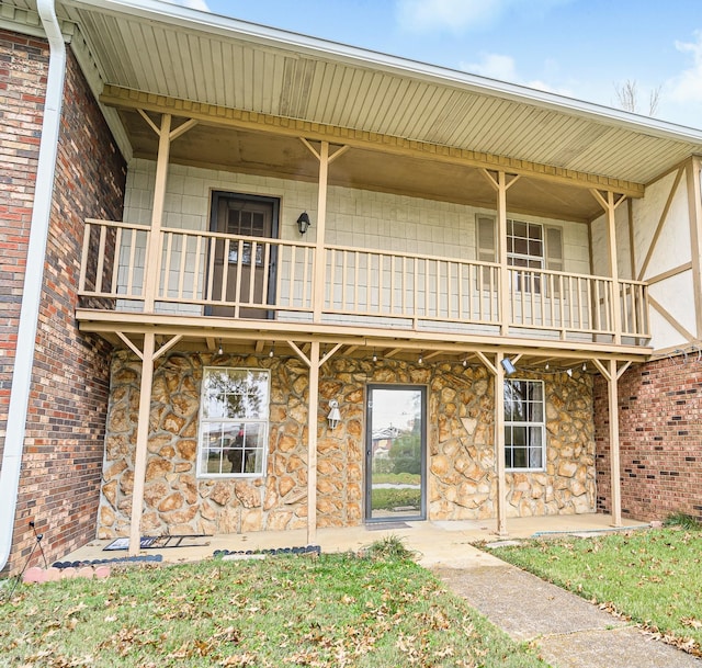 rear view of house featuring a balcony