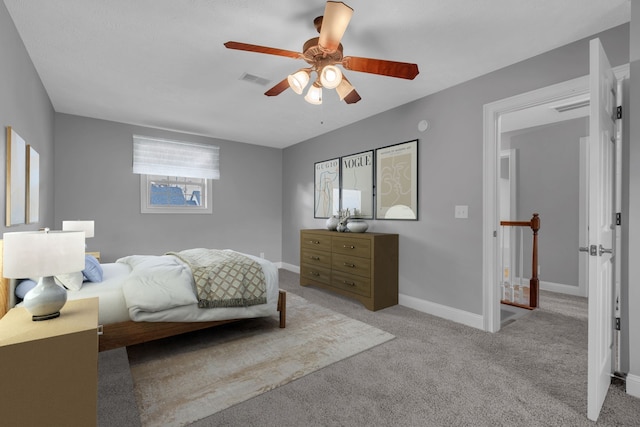 bedroom featuring ceiling fan and light carpet