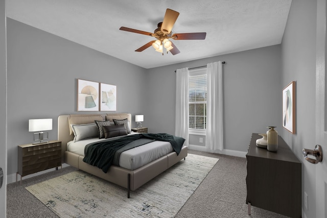 carpeted bedroom featuring ceiling fan and a textured ceiling