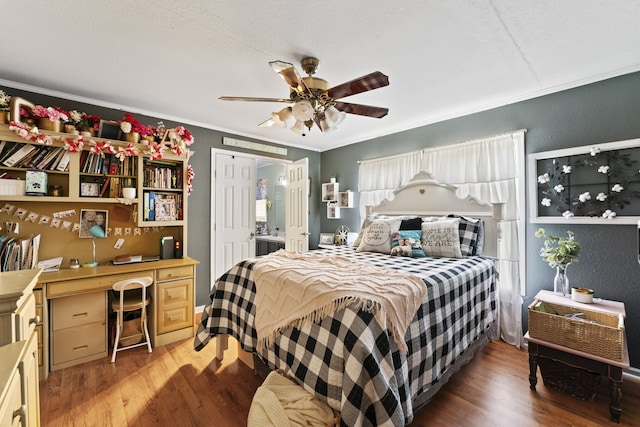 bedroom featuring wood-type flooring, ceiling fan, and crown molding