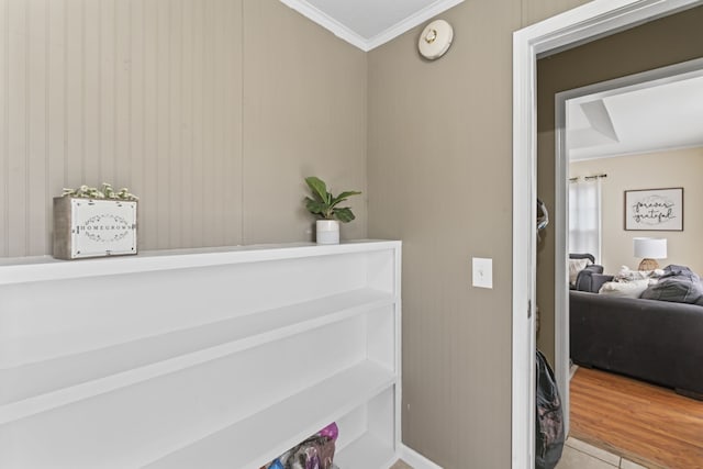 interior space with wood-type flooring and crown molding