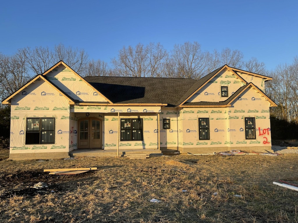 property in mid-construction with a patio area