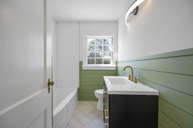 bathroom with wood walls, tile patterned flooring, vanity, and toilet